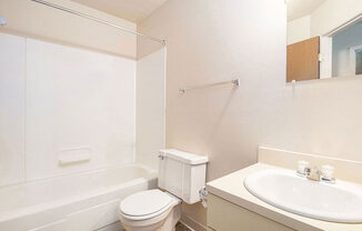 a bathroom with a sink toilet and a bath tub