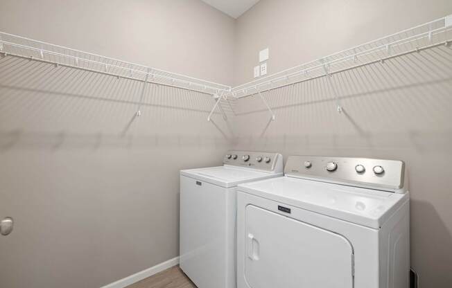 A laundry room with a washer and dryer.