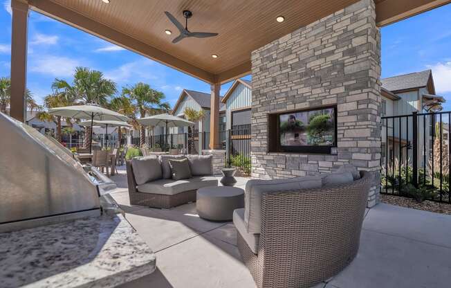 common outdoor patio with furniture and a fireplace at Canter, Ocala, FL, 34474