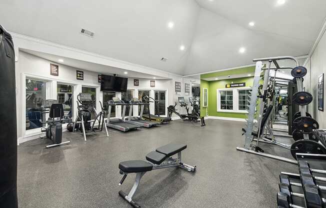 Community Fitness Center with Equipment at Bridges at Oakbend Apartments located in Lewisville, TX.