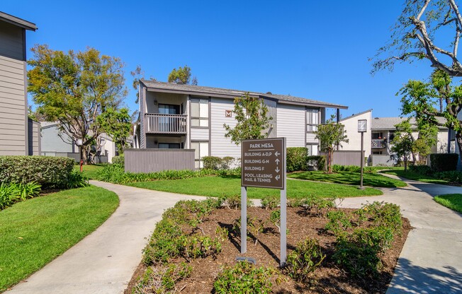 A sign in front of a building that says 