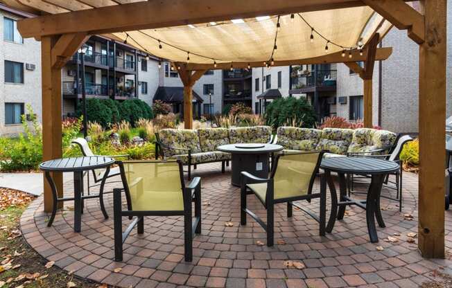 outdoor seating with fire pit in courtyard of riverview highlands apartments