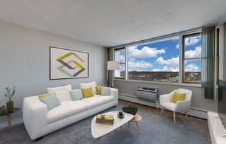 an open living room with a white couch and a table