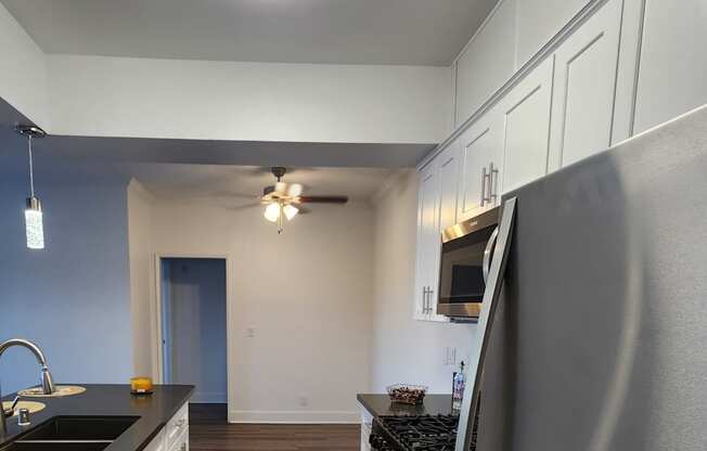 Upgraded kitchen with wood floors and stainless steel appliances