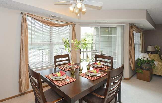 Ceiling Fan and Light in Dining Room with Large Windows