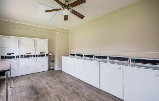 Laundry Room at Bookstone and Terrace Apartments in Irving, Texas