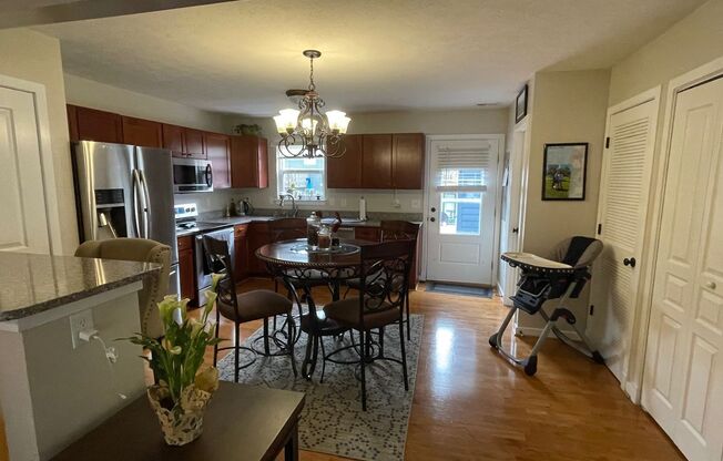 Stylish Townhome with 2 Suites, Hardwood Floors, Stainless Steel Appliances, and Granite Countertops!