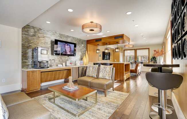 a living room with a kitchen and a table