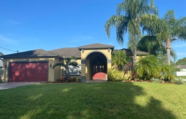 Well maintained large 4/2/2 corner lot pool home on a canal