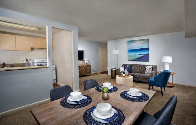 A dining room with a wooden table set with plates and napkins.