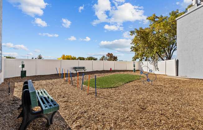 a park with a playground and a bench