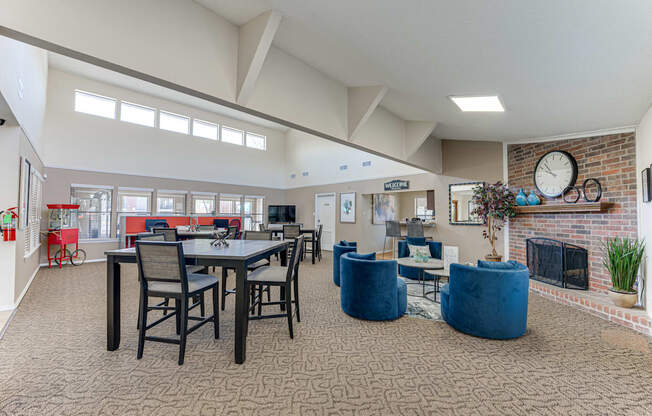 A large open living room with a dining table and chairs.