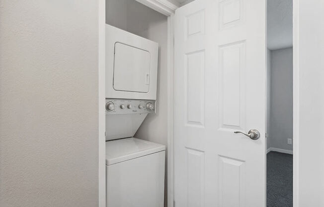 Model Unit Stackable Washer and Dryer Hook Up at Overlook Point Apartments in Salt Lake City, UT.