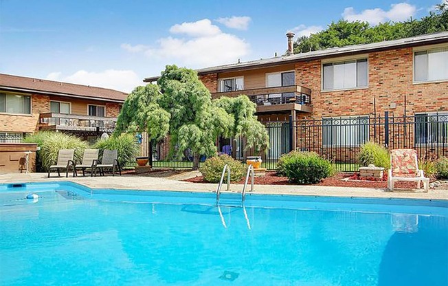 a large swimming pool in front of a building