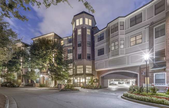 a street view of an apartment building at night at The Hendrix, Georgia, 30329