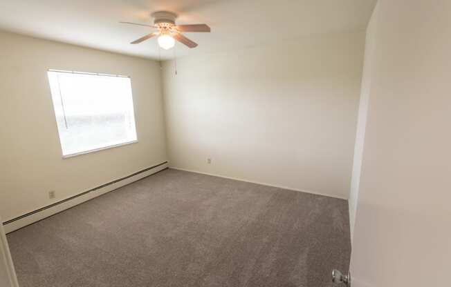 This is a photo of the second bedroom in the 1004 square foot, 2 bedroom, 1.5 bath townhome floor plan at Lake of the Woods Apartments in Cincinnati, OH.