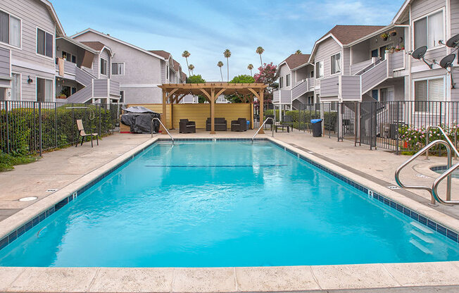 Large courtyard swimming pool, including jacuzzi and lounging area.