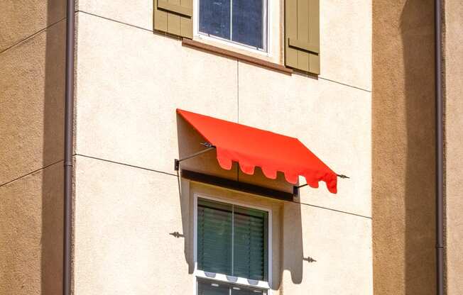 an awning on a window of a building