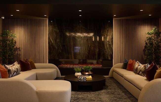 A modern living room with a fireplace and comfortable seating.