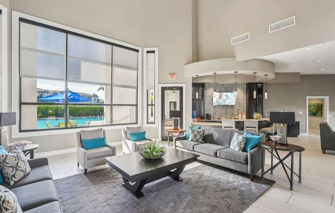 A modern living room with a pool view.