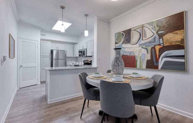 a dining room with a table and chairs