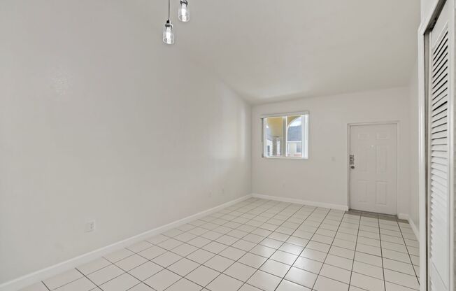 2-bath condo on the 2nd floor with a newly renovated kitchen featuring modern cabinets and granite countertops.