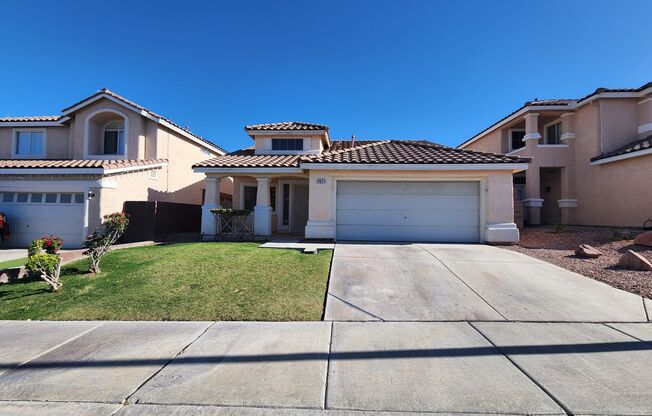 Single story home with tile and granite countertops.