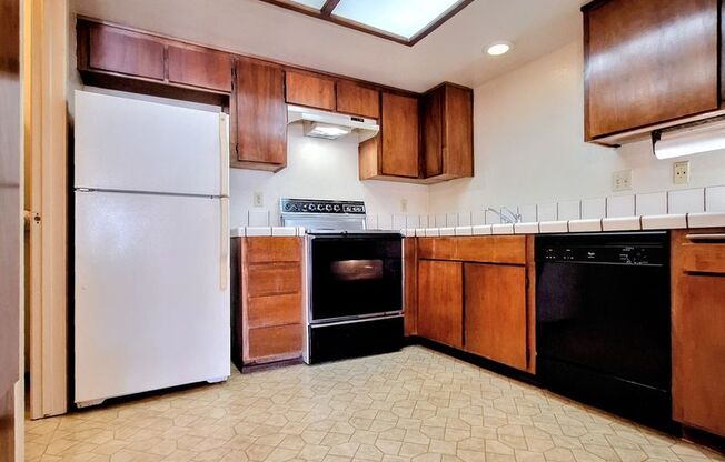 Spacious First Floor 2bd Condo With Laundry In Unit, Pool, Patio, & Carport!