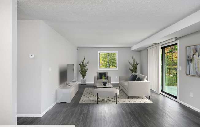 Laurel West End Apartments in Golden Valley, MN photo of a living room with two couches a coffee table and a tv on the wall