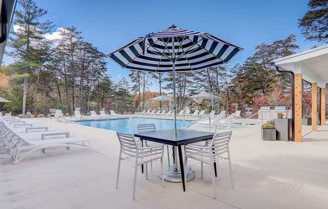 Pool area with chairs and umbrellas