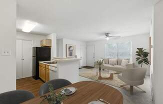 A modern kitchen with a dining table set for two.