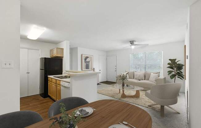 A modern kitchen with a dining table set for two.