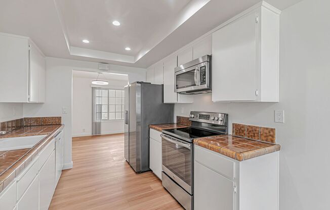 Beautifully Updated 4-Bed, 2.5-Bath Corner Home with Garage & Pool Access