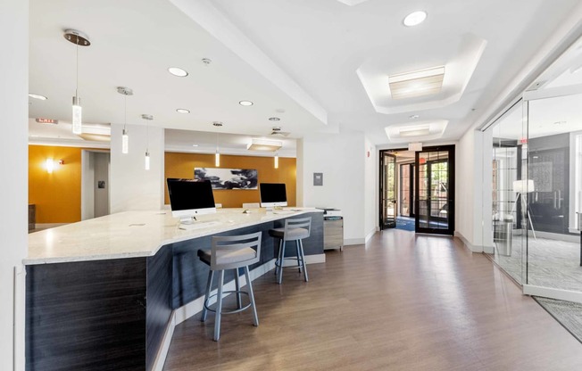 a large office space with a long counter and chairs  at The Lena, New Jersey