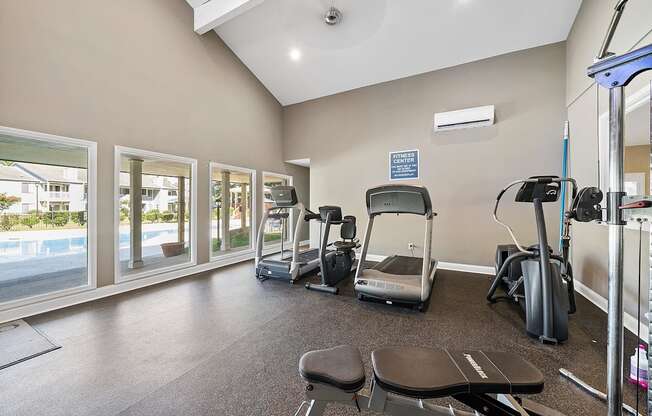 A gym with treadmills, exercise bikes, and a sign that says "Centre".