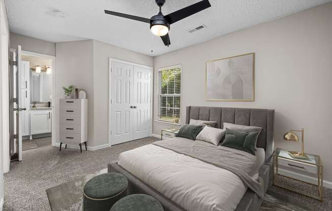 addison point interior staged model bedroom with a bed and a ceiling fan