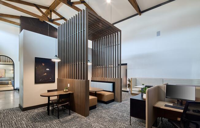 A modern office space with a wooden partition and a black and white checkered floor.