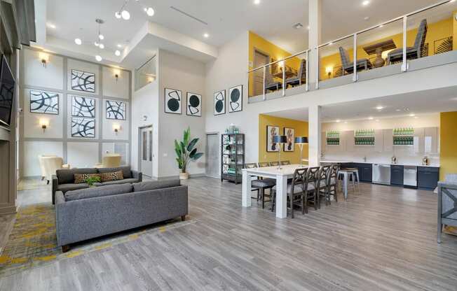a living room and dining room with a table and chairs