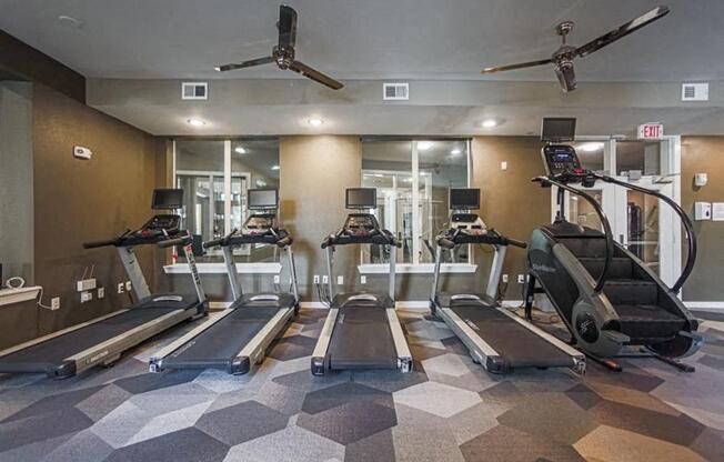 fitness center with cardio equipment at Aspire at 610 apartments