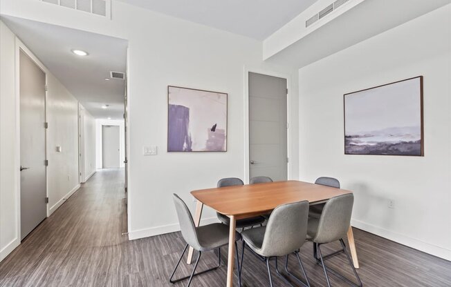 A conference room with a long table and chairs.