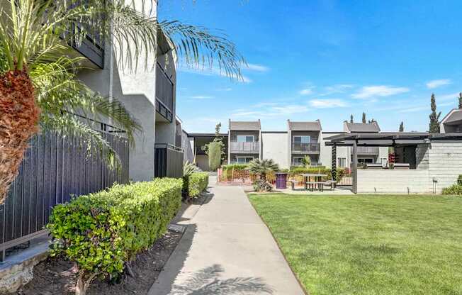 A sunny day at a residential area with a clear blue sky.