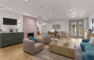 A living room with a fireplace and a television.