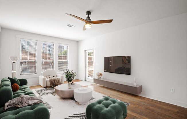 a living room with white walls and a large window