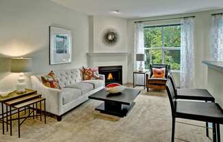 Portsmith Living Room with Fireplace Apartments in Everett, WA