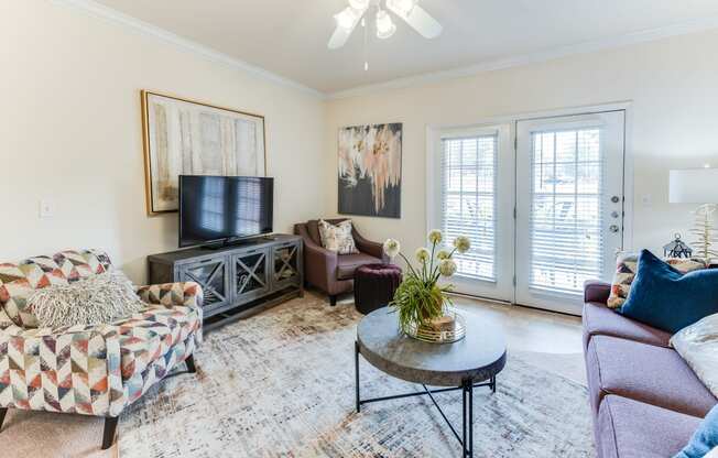 a living room with a couch and a tv