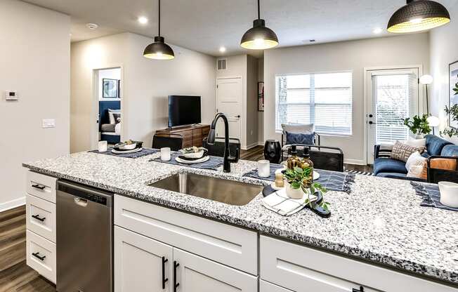 Studio, one and two bedroom apartment homes featuring stainless steel appliances, luxury vinyl floor, granite countertops, large closets and full-size washer and dryer at The Parker in Papillion, NE
