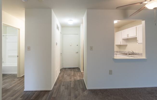 This is a photo of a large kitchen pass through and the entryway in a 560 square foot 1, 1 bath apartment at Park Lane Apartments in Cincinnati, OH.