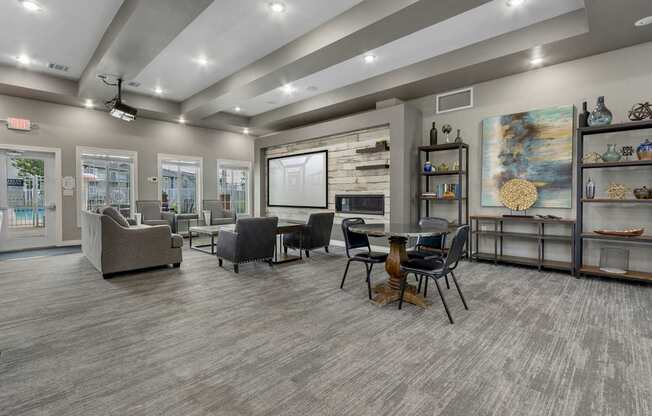 A modern living room with grey flooring and furniture.