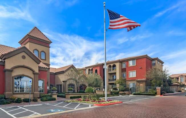 an flag in front of a building with a parking lot