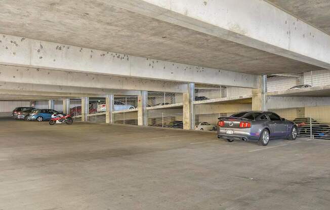 Private covered parking garage with overhead lighting.